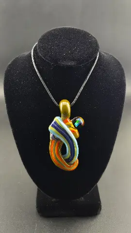 Color Current, a hand-blown glass pendant by Jared Omas with sweeping ribbons of blue, yellow, orange and purple and a bright opal accent