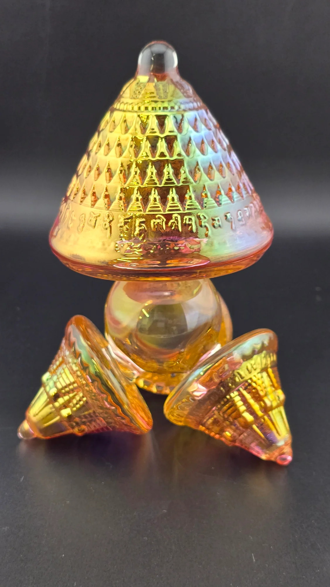 Amber Crown glass mushroom sculpture, detail of ribbed stems and clear glass base