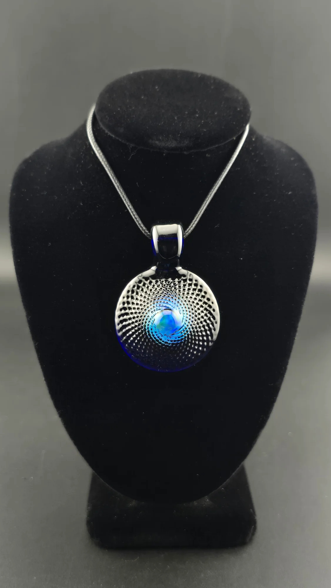 Deep Current, a Temple Key series hand-blown glass pendant by Jared Omas with an opal centre in deep blue