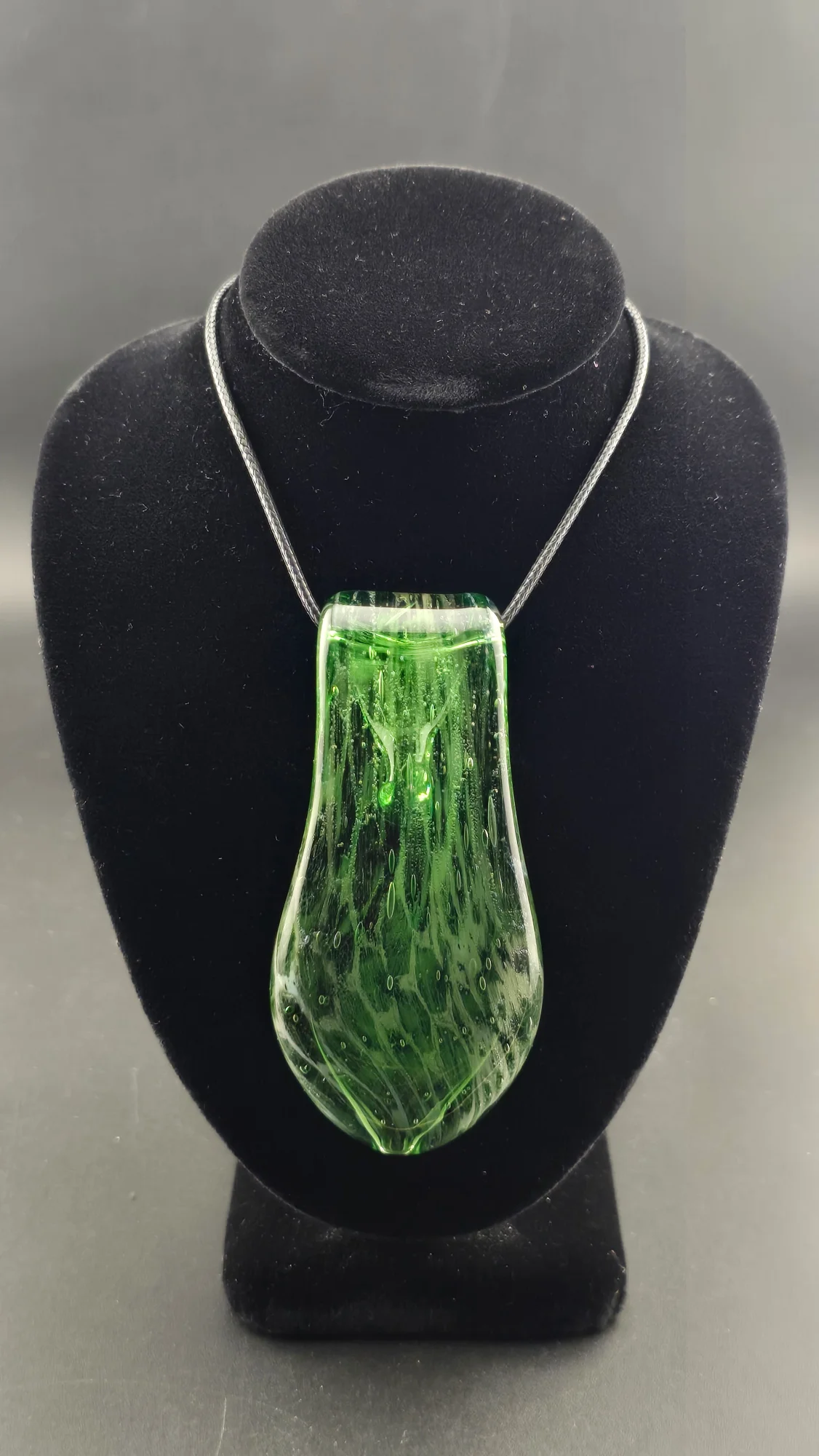 Forest Rain, a hand-blown glass pendant by Jared Omas in rich green tones with tiny suspended bubbles
